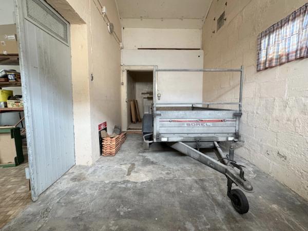 Maison de village de 130 m² avec garage, atelier indépendant et jardin paysager