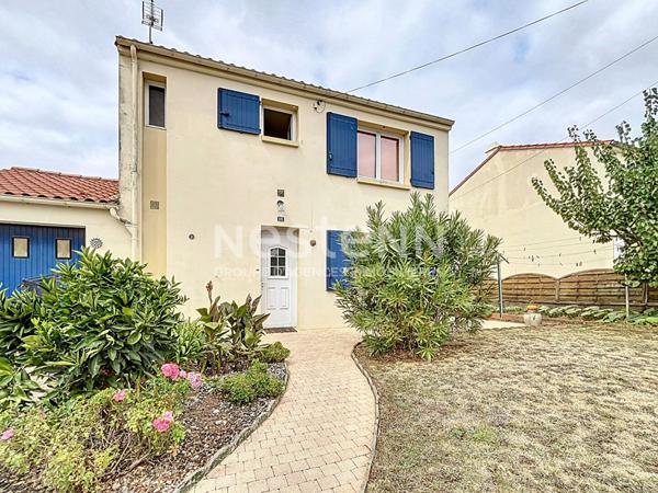 Maison familiale avec véranda, garage et jardin, quartier calme à Fontenay-le-Comte