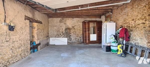 Maison ancienne rénovée en pierre en duplex d'environ 50 m² avec garage de 30 m²