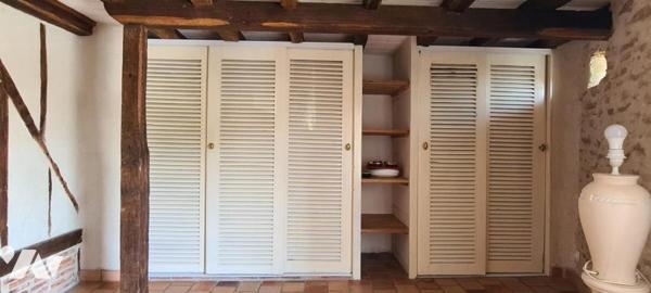 Maison ancienne rénovée en pierre en duplex d'environ 50 m² avec garage de 30 m²