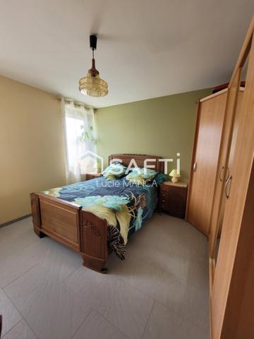 Maison avec garage et terrain constructible