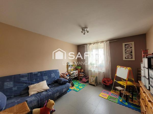 Maison avec garage et terrain constructible