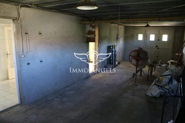 Maison 6 pièces avec grand garage et potentiel d’aménagement