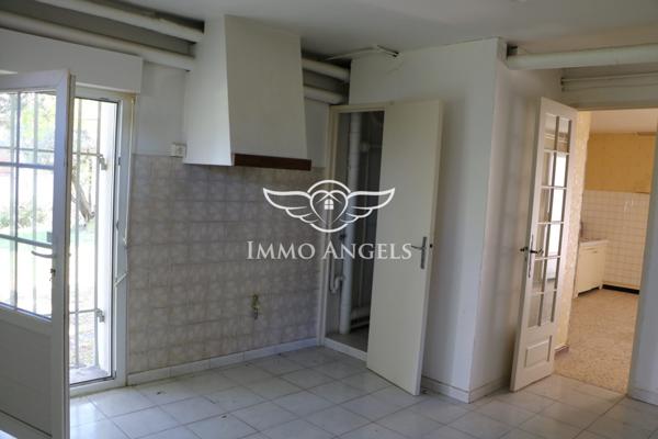 Maison 6 pièces avec grand garage et potentiel d’aménagement