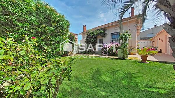 Maison de caractère plain-pied (106 m² surface utile totale avec dépendances), jardin paysager  et garage au cœur de Saint-Cyprien Village
