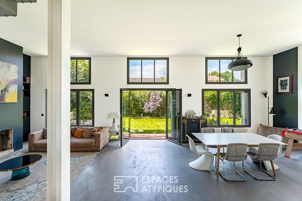 Maison transformée esprit loft avec terrasse et jardin