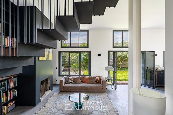 Maison transformée esprit loft avec terrasse et jardin