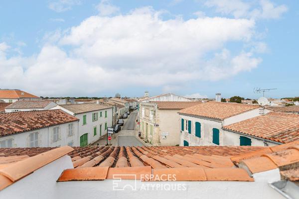 Maison de village et sa terrasse sur le toit