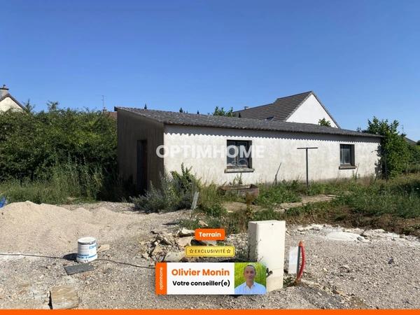 Terrain à bâtir de 400,00 m² avec garage de 60 m2 existant, libre constructeur