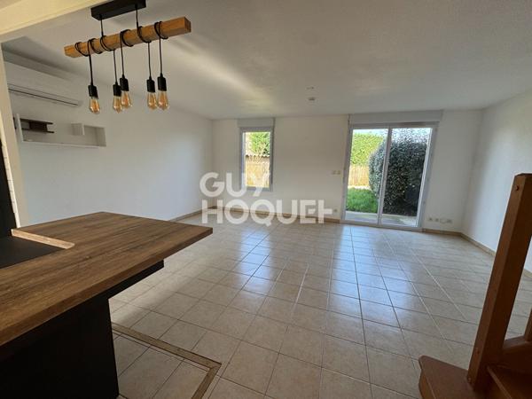 Villa T4 avec jardin et garage.