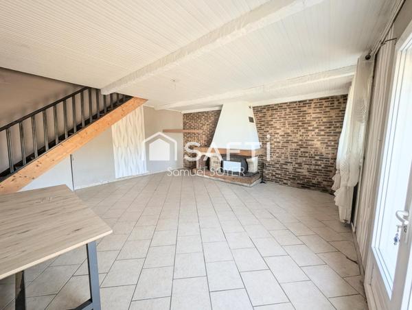 ENSEMBLE DE 2 HABITATIONS AVEC GARAGES ET JARDIN