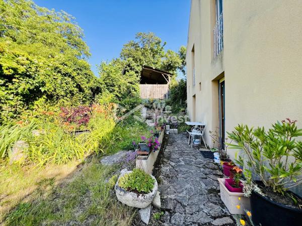 Propriété de 243 m² habitables, avec garage, terrain