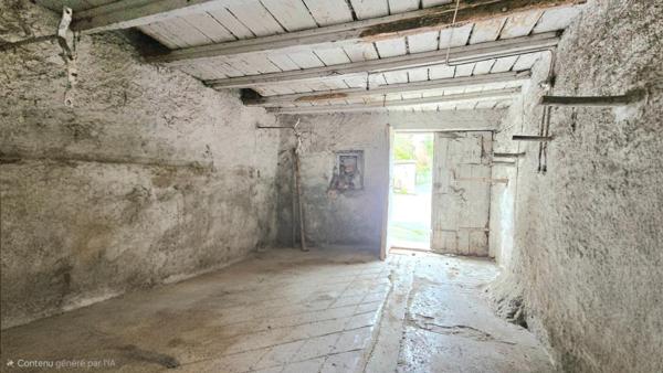 grange de 100 m2 au sol avec une toiture complètement refaite