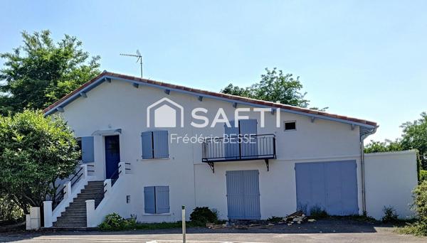 Maison T6 125m² avec garages et jardin de 2200m².
