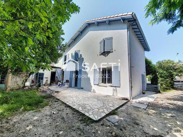 Maison T6 125m² avec garages et jardin de 2200m².