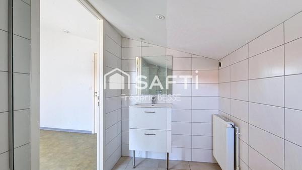 Maison T6 125m² avec garages et jardin de 2200m².