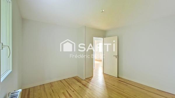 Maison T6 125m² avec garages et jardin de 2200m².