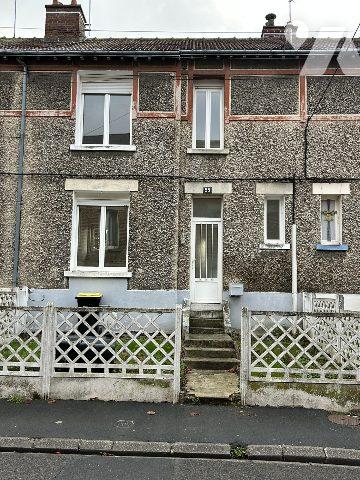 Ensemble de 4 maisons mitoyennes (2 louées)avec jardin et une partie constructible