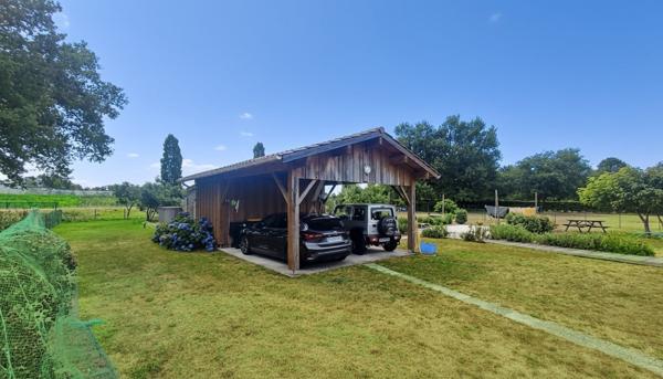 Maison bois de 2007 – 106 m² – 3 chambres – Piscine – Terrain arboré de 2722 m²