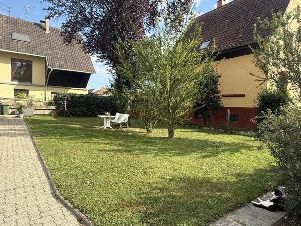 Appartement 3 pièces au 1e étage de 68 m² avec jardin parking et cave