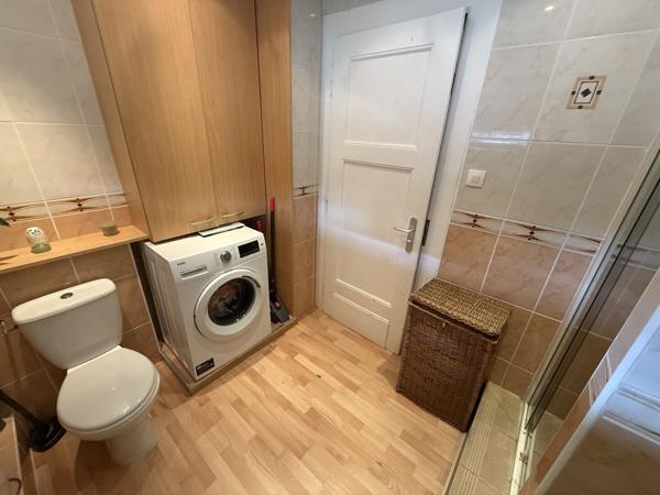 Appartement 3 pièces au 1e étage de 68 m² avec jardin parking et cave