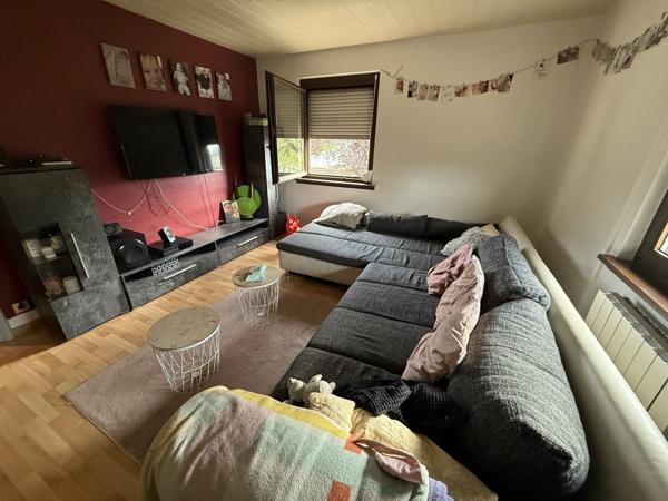 Appartement 3 pièces au 1e étage de 68 m² avec jardin parking et cave