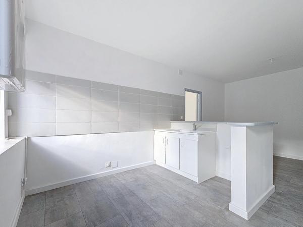 Immeuble de trois appartements offrant une belle rentabilité