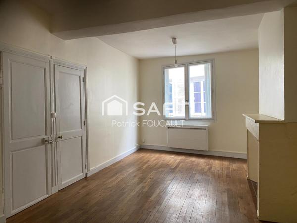 Immeuble de rapport avec local commercial + cave