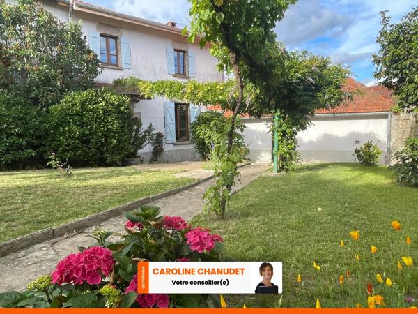 Maison en pierre  avec jardin deux garages et dépendances