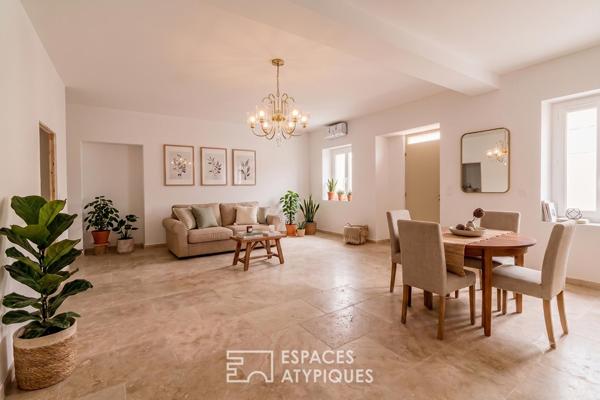 Appartement rez-de-jardin avec patio privé et garage au centre-ville