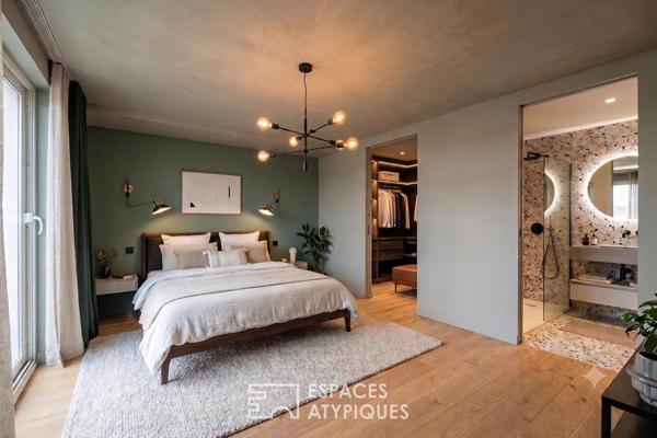 Appartement rez-de-jardin avec patio privé et garage au centre-ville
