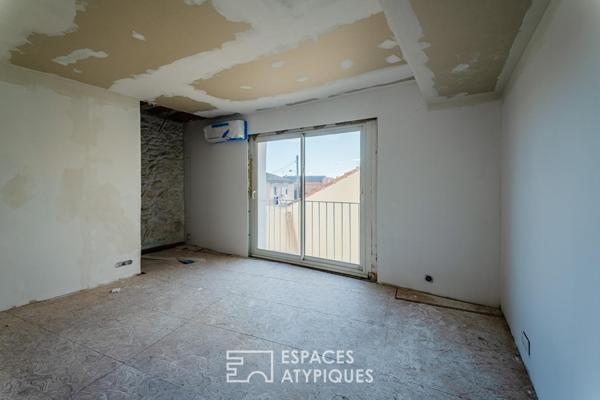 Appartement rez-de-jardin avec patio privé et garage au centre-ville
