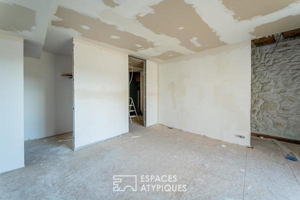 Appartement rez-de-jardin avec patio privé et garage au centre-ville