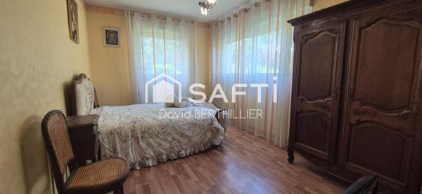 appartement en rez de jardin , avec véranda dans une copropriété securisée à 2 min du centre ville