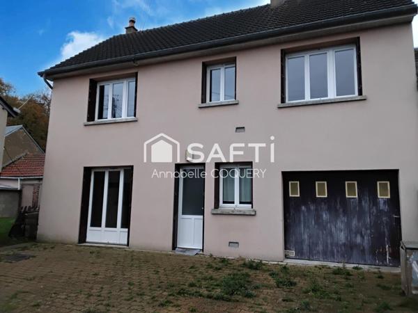 Bien immobilier composé de 2 maisons avec garages.