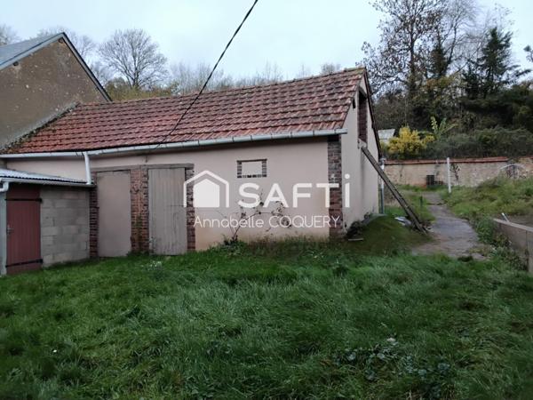 Bien immobilier composé de 2 maisons avec garages.