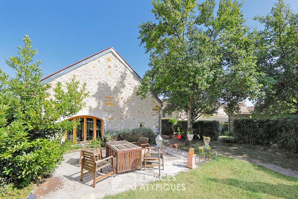 Maison en pierre avec un généreux jardin et ses arbres fruitiers