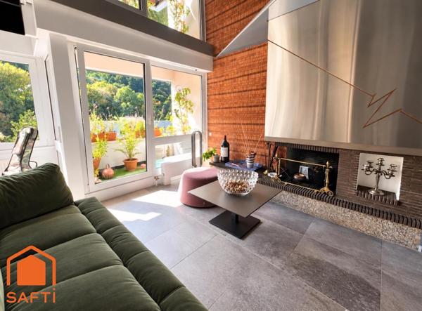 Superbe appartement avec terrasses, 2 caves et garage