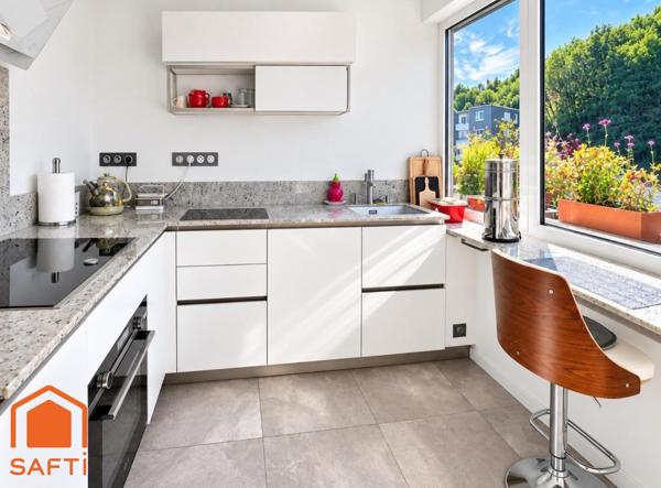 Superbe appartement avec terrasses, 2 caves et garage