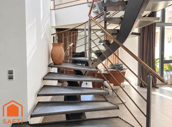Superbe appartement avec terrasses, 2 caves et garage