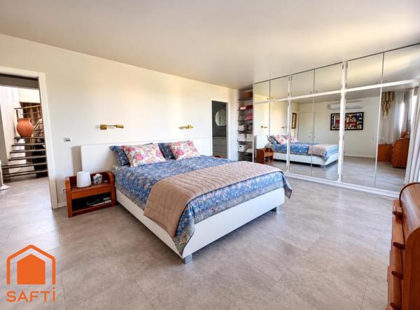 Superbe appartement avec terrasses, 2 caves et garage