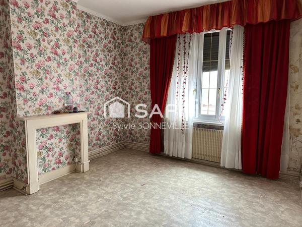 Maison mitoyenne avec potentiel et cachet