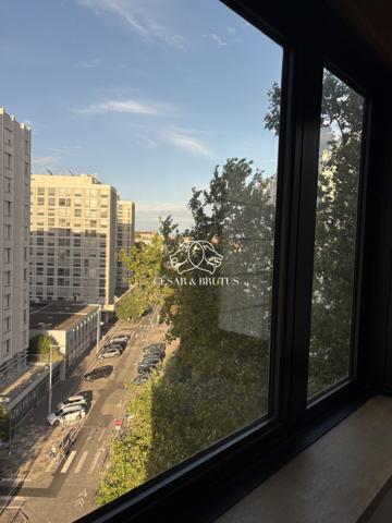 Appartement T3 de 62,83 m² avec séjour en rotonde et parking privé, idéalement situé au cœur du 6e arrondissement de Lyon, étage élevé.