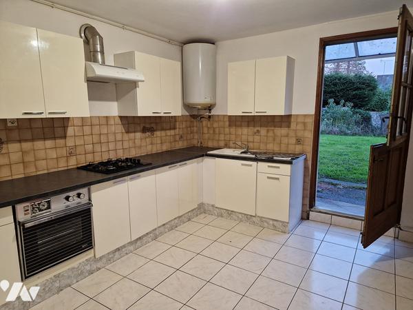 Maison de 73 m2 en centre ville avec un terrain de 318 m2 et un garage