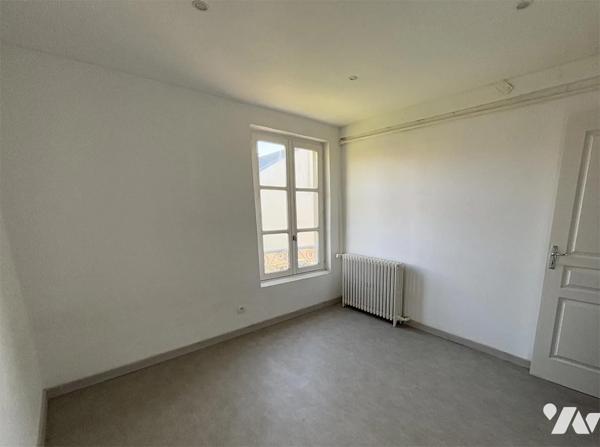 Maison de 73 m2 en centre ville avec un terrain de 318 m2 et un garage