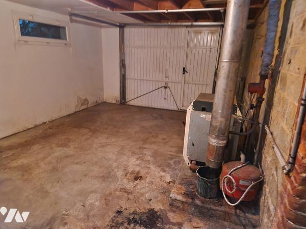 Maison de 73 m2 en centre ville avec un terrain de 318 m2 et un garage