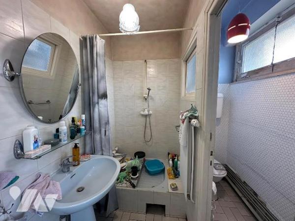 Maison semi-individuelle à vendre à Petite-Synthe, construite en 1955, avec façade en brique et...