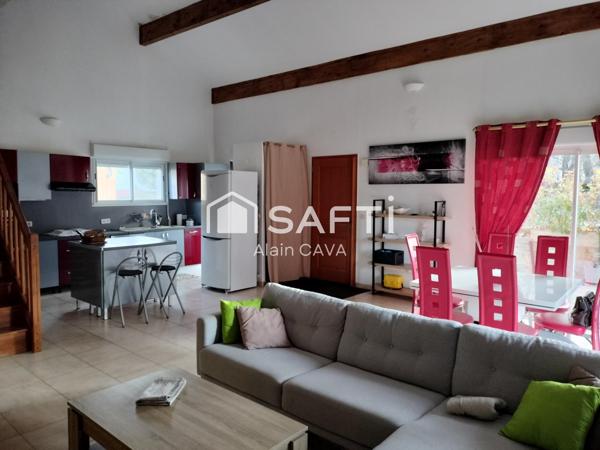 Appartement de 122m² avec mezzanine terrasse et parking dans une maison divisée en 2 logments