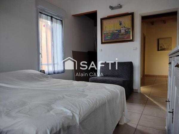 Appartement de 122m² avec mezzanine terrasse et parking dans une maison divisée en 2 logments