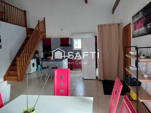 Appartement de 122m² avec mezzanine terrasse et parking dans une maison divisée en 2 logments